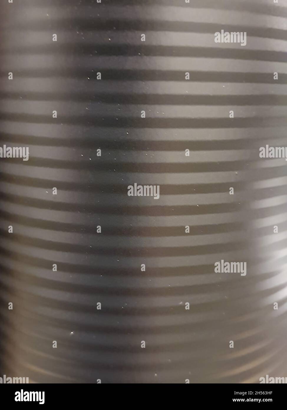 Metallic surface in matte black, smooth, with horizontal lines. full screen Stock Photo