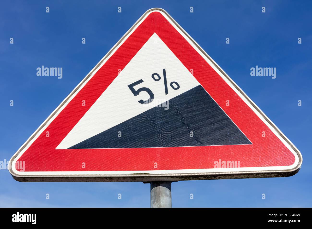 German road sign: steep grade/upwards 5% Stock Photo