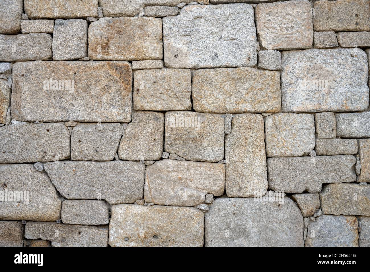Natural background from an old stone wall Stock Photo