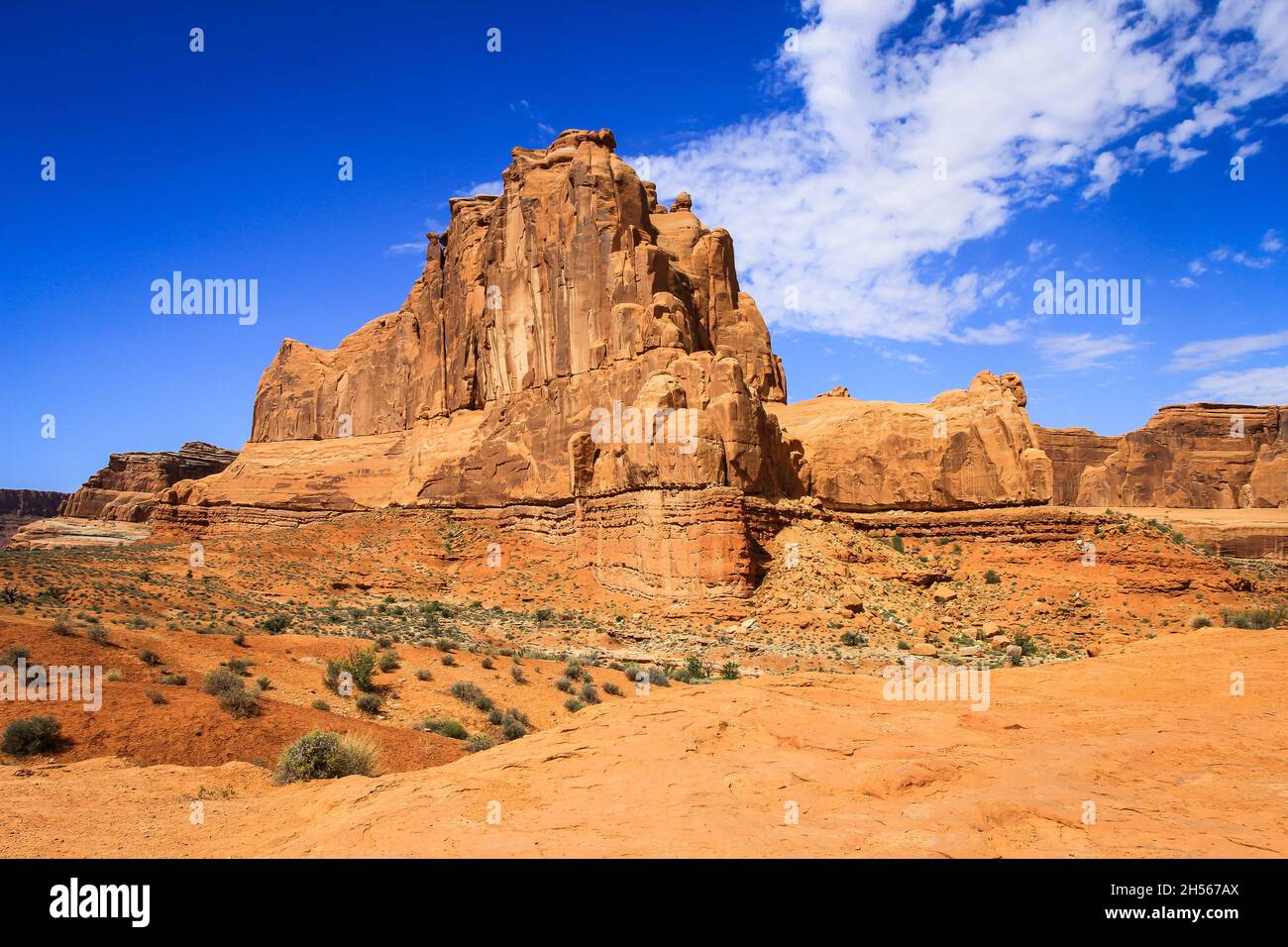 Arches National Park popular feature Courthouse Towers under blue sky with clouds | Landscape with amazing sandstone formation, tall stone columns Stock Photo