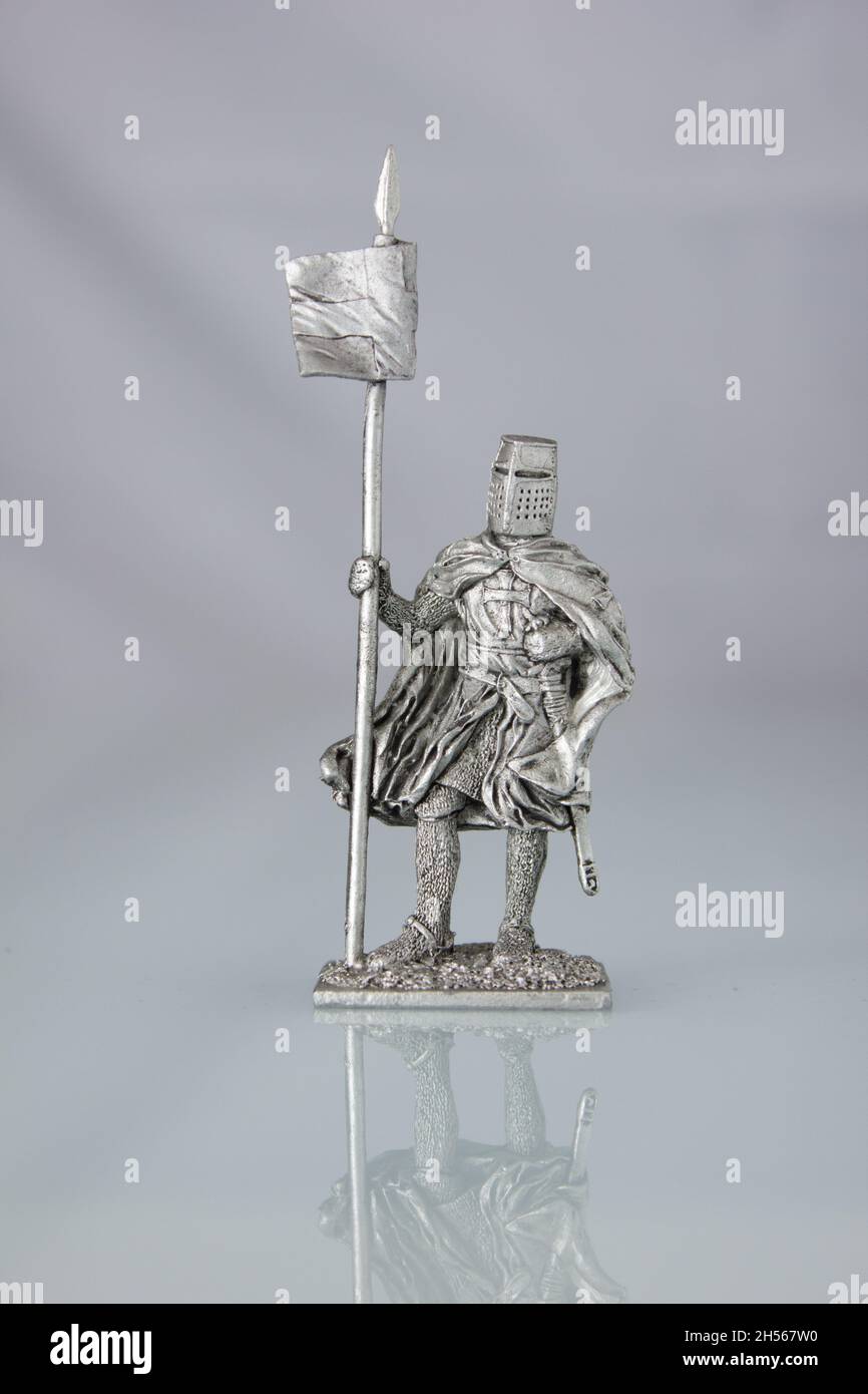 Tin soldiers of medieval knights. A knight with a banner Stock Photo