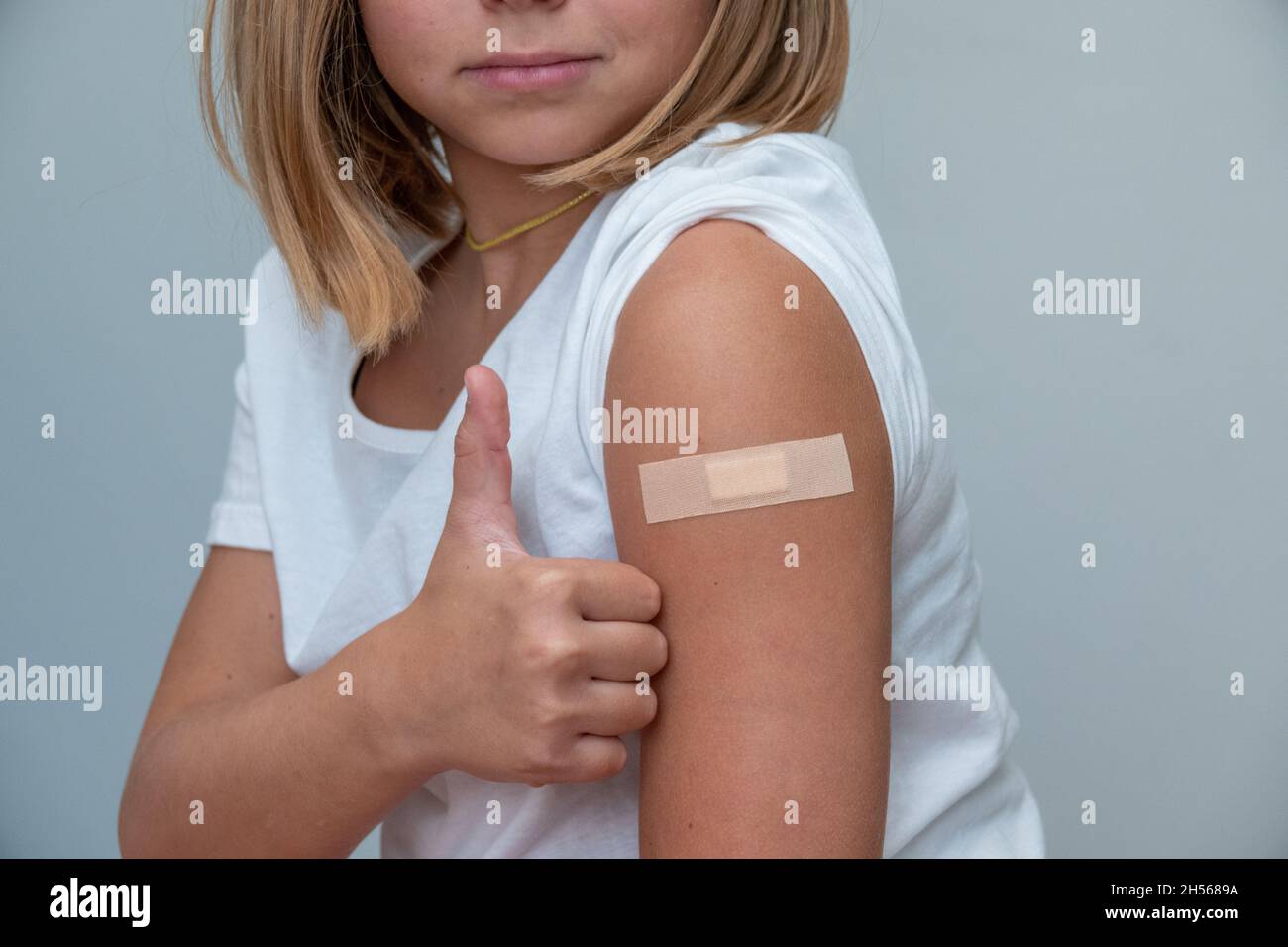 Children receiving vaccine at out side of the thigh.Children vaccine. Stock Photo