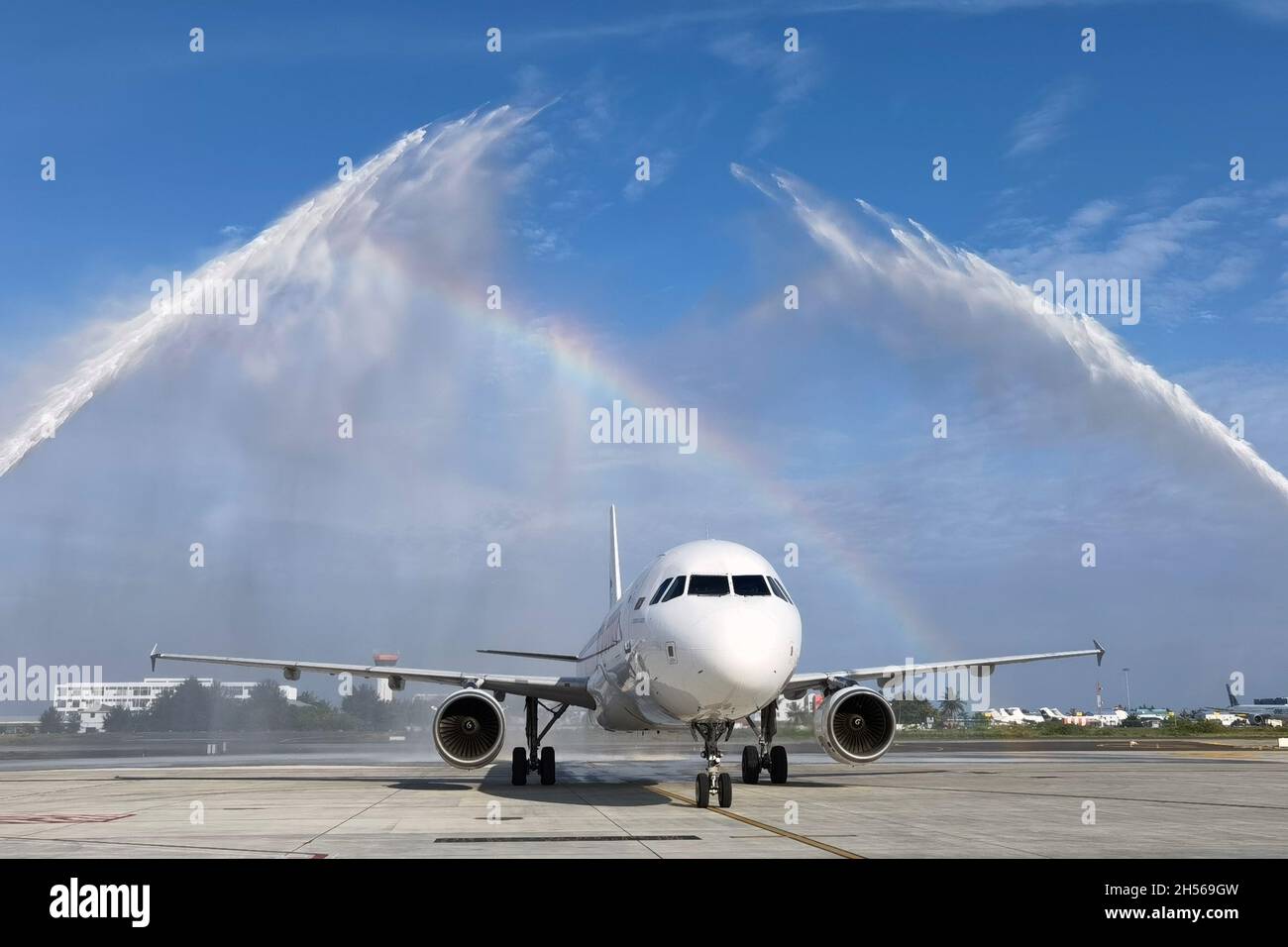 (211107) -- MALE, Nov. 7, 2021 (Xinhua) -- A water salute is seen to celebrate the inauguration of the newly expanded west apron at the Velena International Airport (VIA) in Maldives, Nov. 4, 2021. The expanded apron covers an area of 35,000 square meters and is part of the VIA development project. It was built by Beijing Urban Construction Group to international standards and can accommodate a maximum of nine code C aircraft. (Beijing Urban Construction Group/Handout via Xinhua) Stock Photo