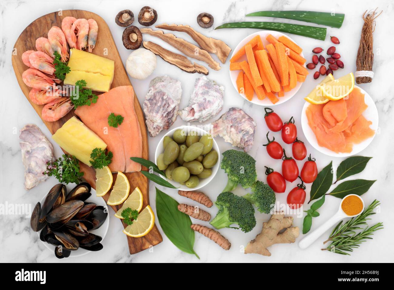 Immune system boosting health food collection. Seafood, vegetables, fruit, medicinal herbs and spice. High in antioxidants, anthocyanins, protein. Stock Photo
