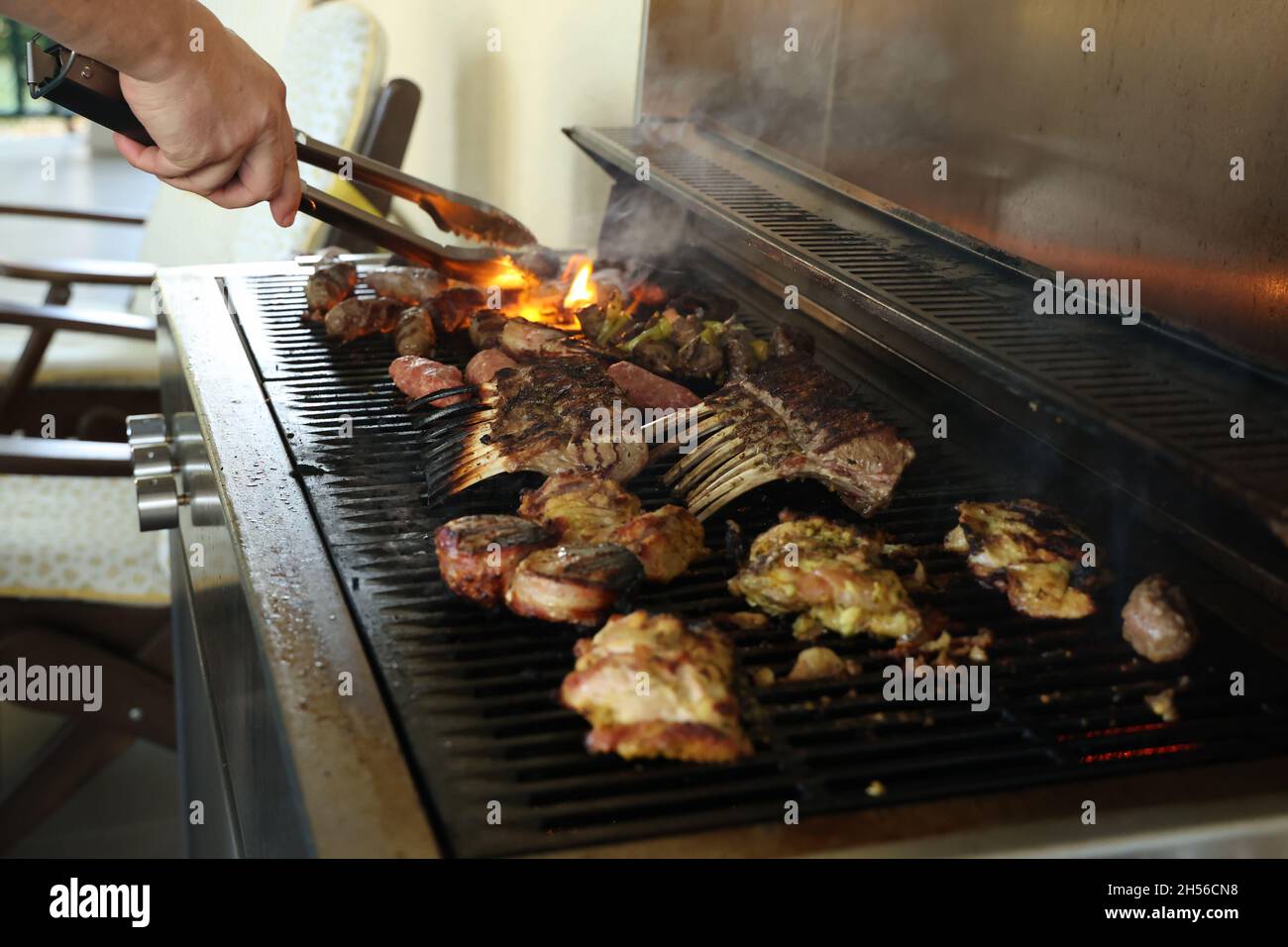 Fried meat on a gas grill, close-up Stock Photo