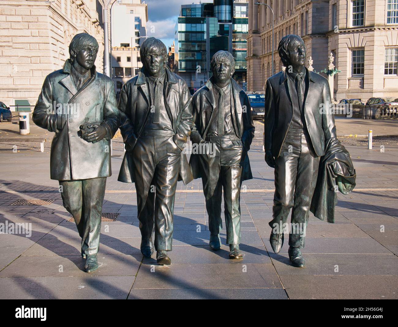 An iconic statue of The Beatles in their home town of Liverpool - located on the Pier Head on the River Mersey waterfront. Sculpted by Andrew Edwards Stock Photo