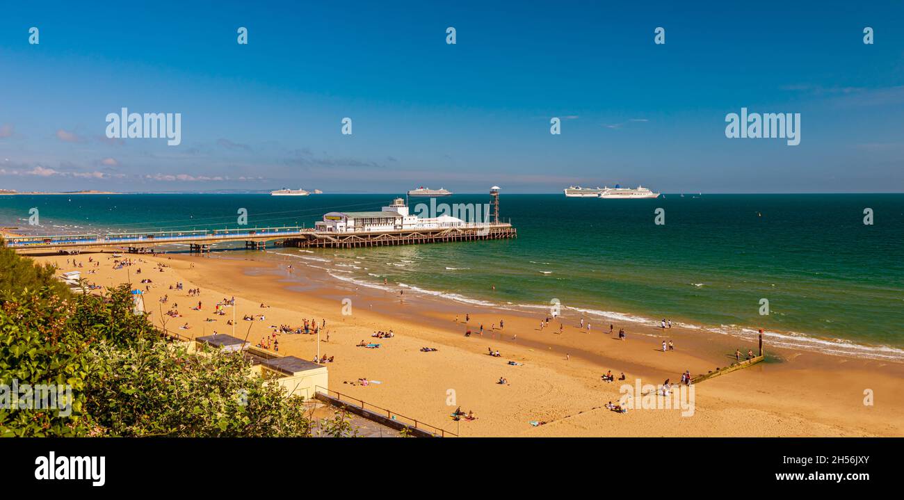 During Covid lockdown cruise liners moored for months off Bournemouth beach and pier in Poole Bay Stock Photo