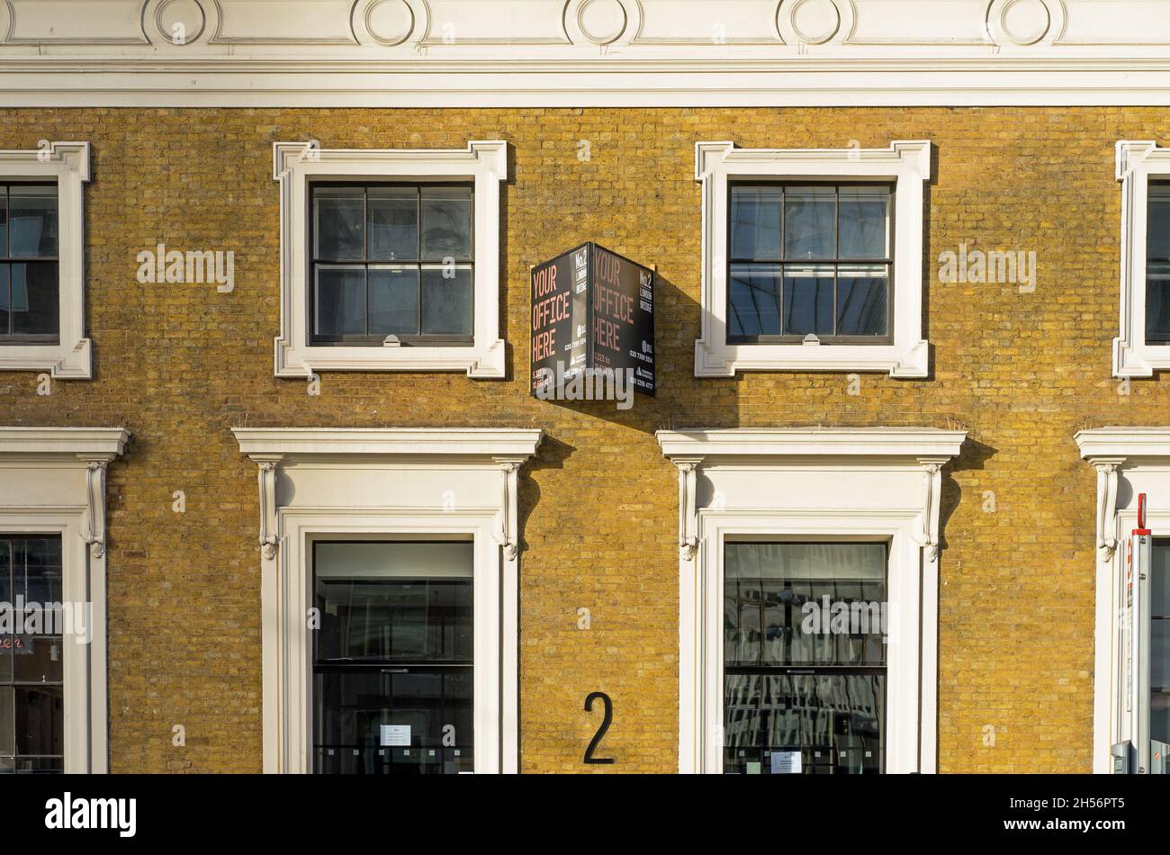 Office To Let sign on a brick wall of an office building in London Stock Photo