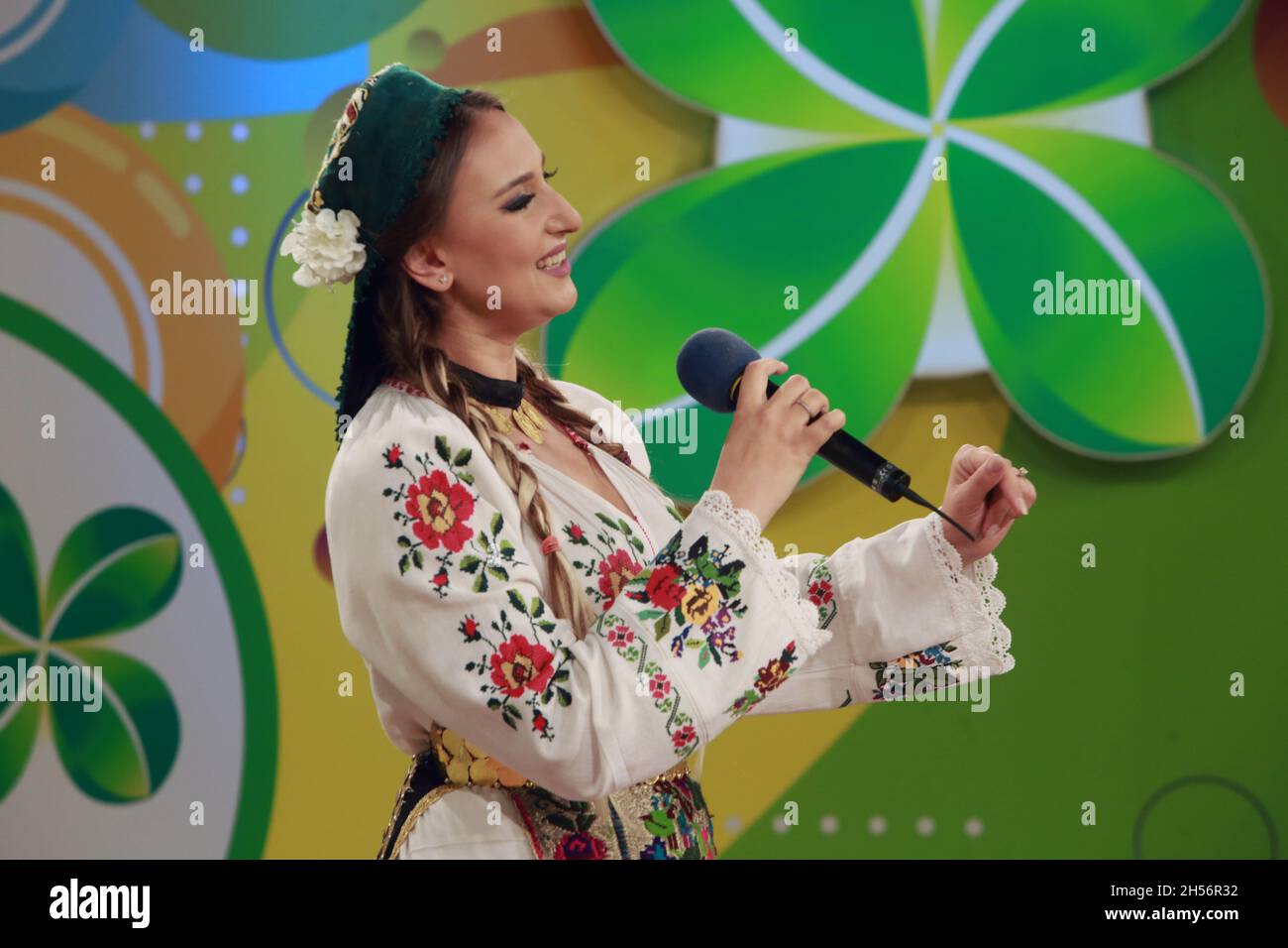 BUCHAREST, ROMANIA - October 31, 2021: Anca Pantaru, the folk singer of traditional Romanian music sings in the TV studio of Lottery. Stock Photo