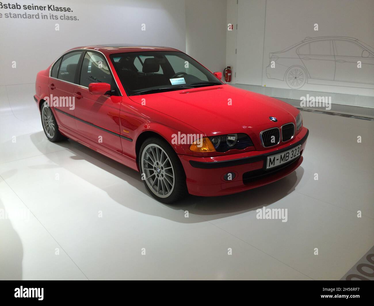 BMW 3 Series (E46): Side view, color red, 4th generation, manufactured from 1998 to 2006. BMW Museum, Munich - Germany - September 2013. Stock Photo