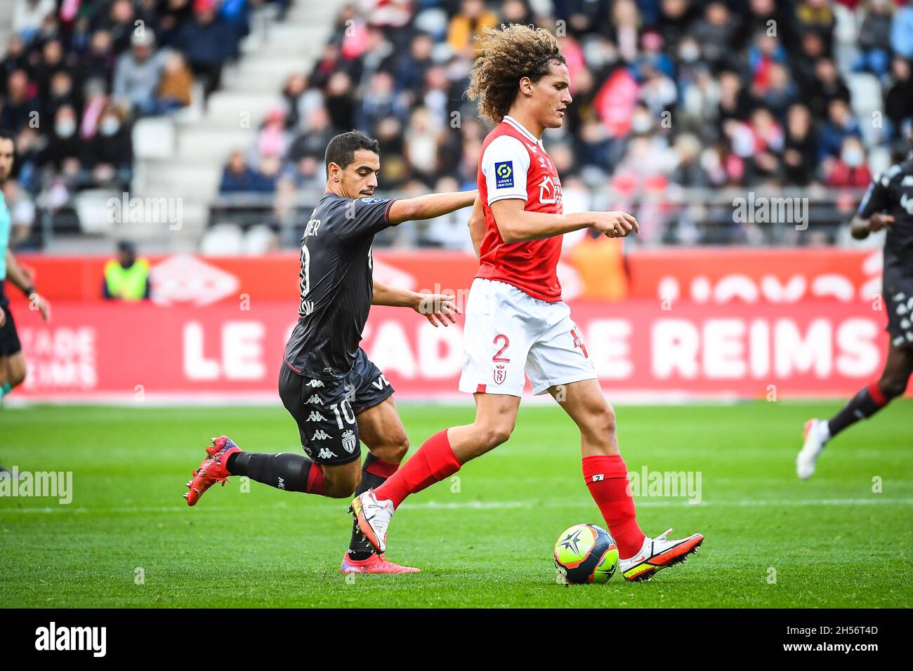 Wissam BEN YEDDER of Monaco and Wout FAES of Reims during the French  championship Ligue 1 football match between Stade de Reims and AS Monaco on  November 7, 2021 at Auguste Delaune
