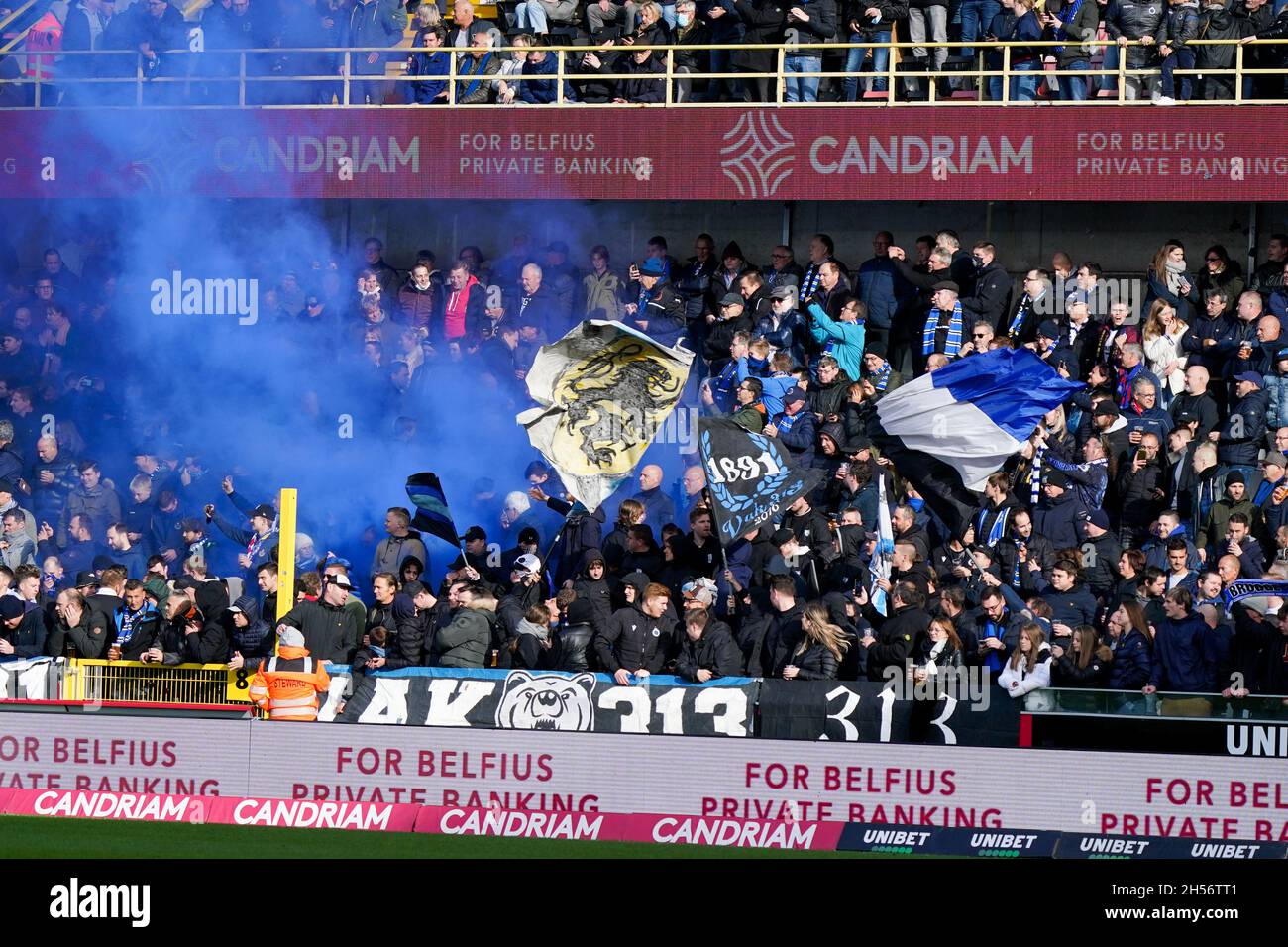 Club Brugge fans in the stands celebrate the result after the