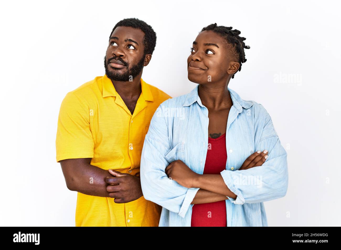 Young african american couple wearing casual clothes smiling looking to ...