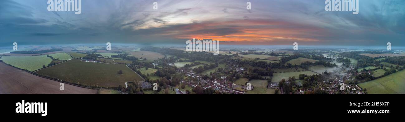 Hambledon, UK - October 17, 2021:  Misty autumn sunrise over the Hampshire village of Hambledon in the South Downs National Park Stock Photo