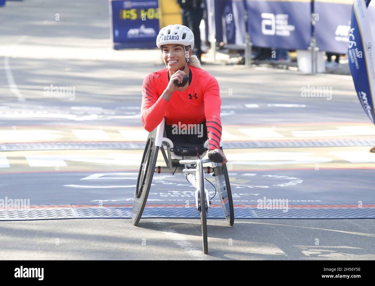 New York, United States. 07th Nov, 2021. Madison de Rozario of Australia celebrates after crossing the finish line first and winning the Women's Wheelchair Division at the 2021 NYRR TCS New York City Marathon in New York City on Sunday, November 7, 2021. Over 50,000 runners from New York City and around the world race through the five boroughs on a course that winds its way from the Verrazano Bridge before crossing the finish line by Tavern on the Green in Central Park. Photo by John Angelillo/UPI Credit: UPI/Alamy Live News Stock Photo