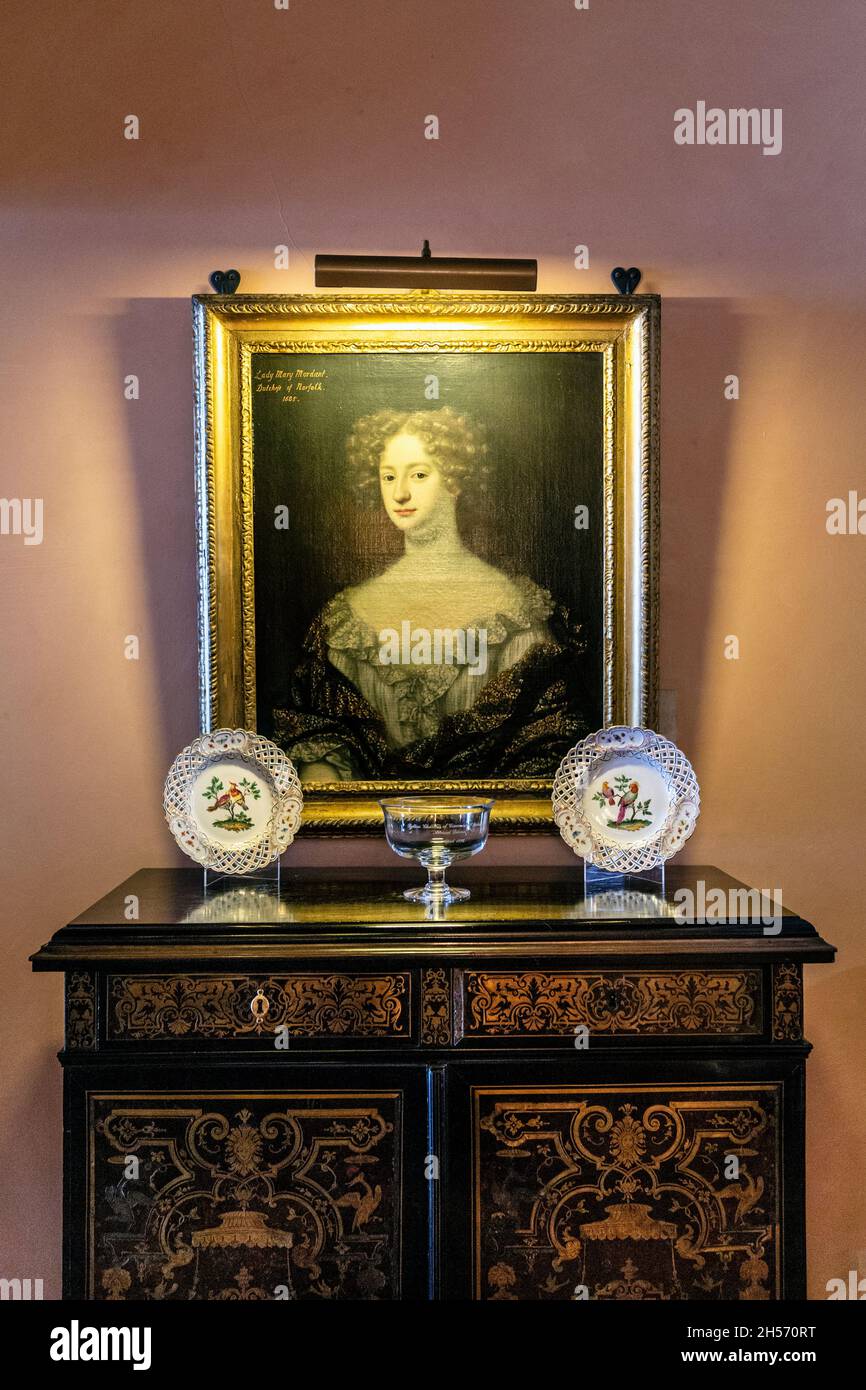 Painted portrait of Lady Mary Mordant, Dukes of Norfolk an on ornate antique cabinet, Arundel Castle, West Sussex, UK Stock Photo
