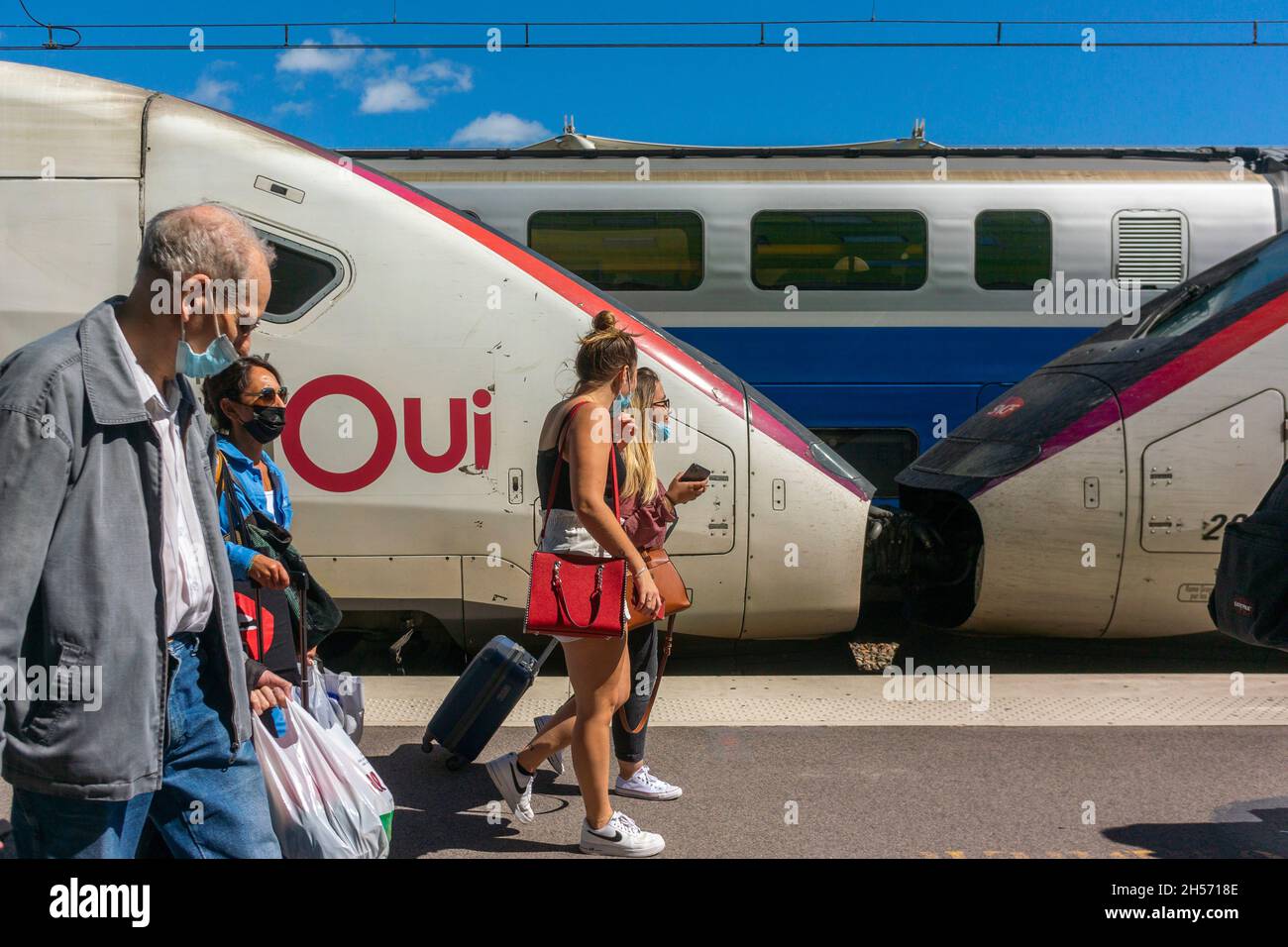 Paris, France, TGV Train in Station, People travelling with masks on Platform Stock Photo