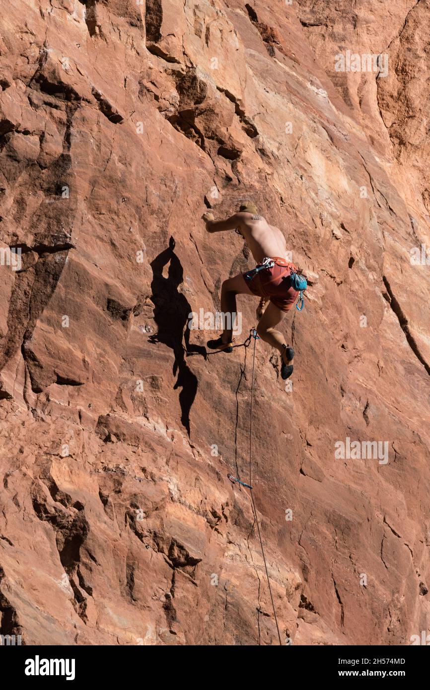 A sport climber on lead falls off the wall called the Theater near Moab, Utah Stock Photo Alamy