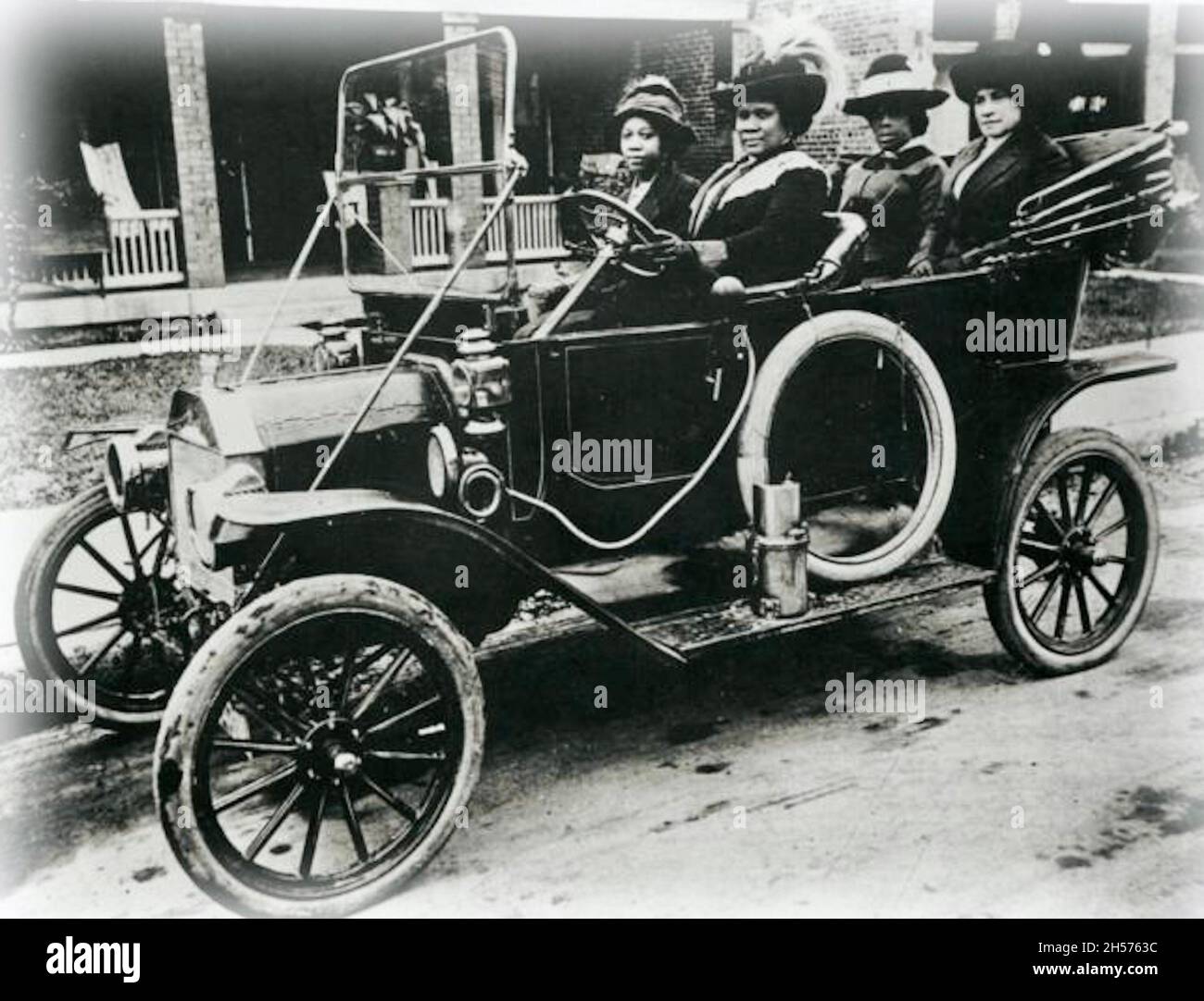 Madame C J Walker driving automoblie - She is recorded as the first female self-made millionaire in America in the Guinness Book of Records Stock Photo