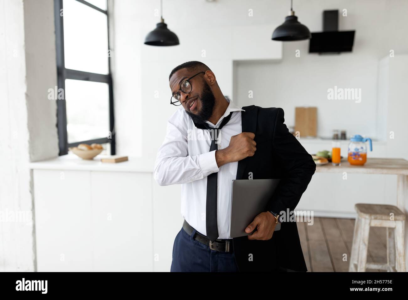 African American man talking on mobile phone in a hurry Stock Photo