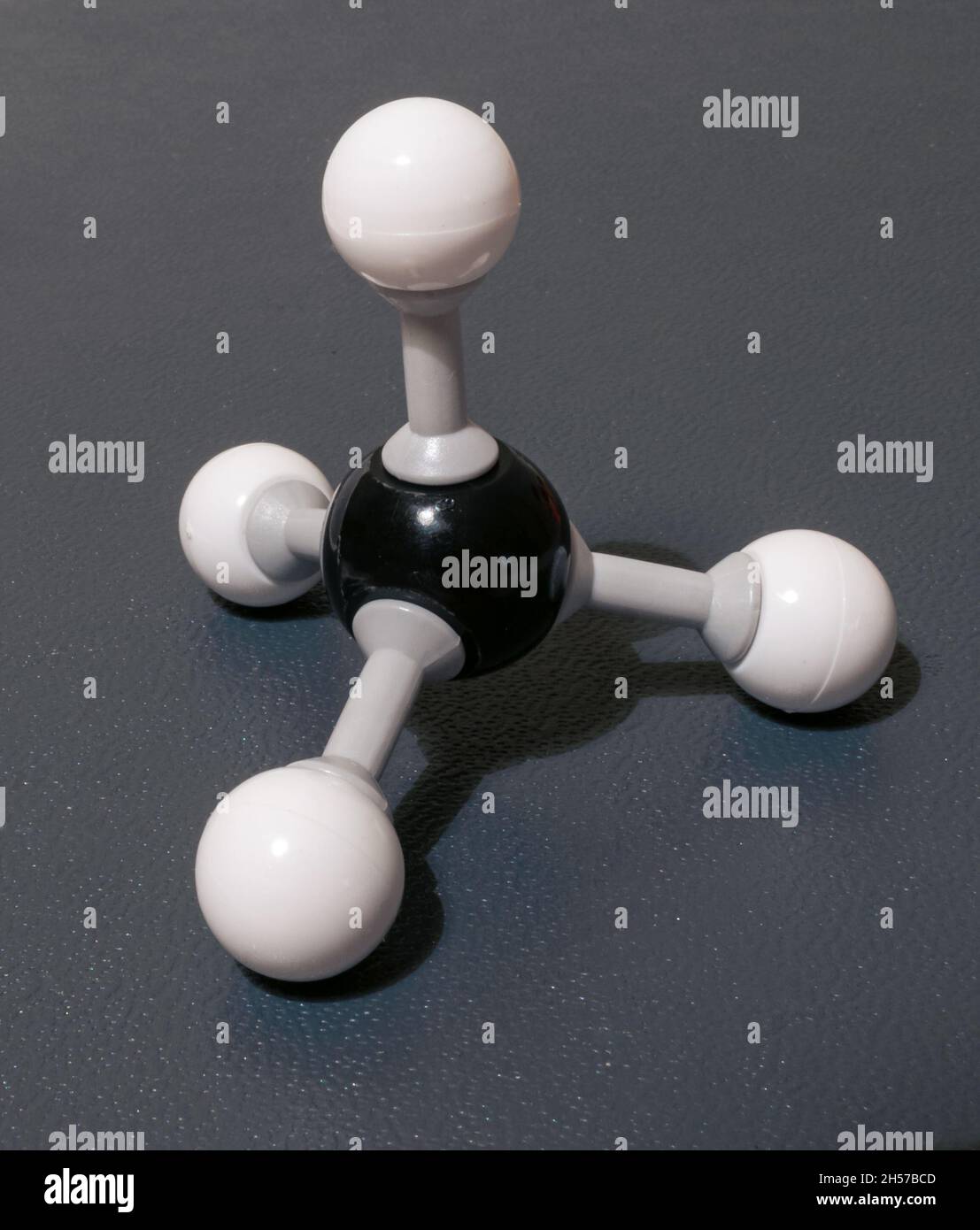 Model of methane (CH4) molecule, responsible for heating of the atmosphere and climate change. Model used in chemistry class. Stock Photo
