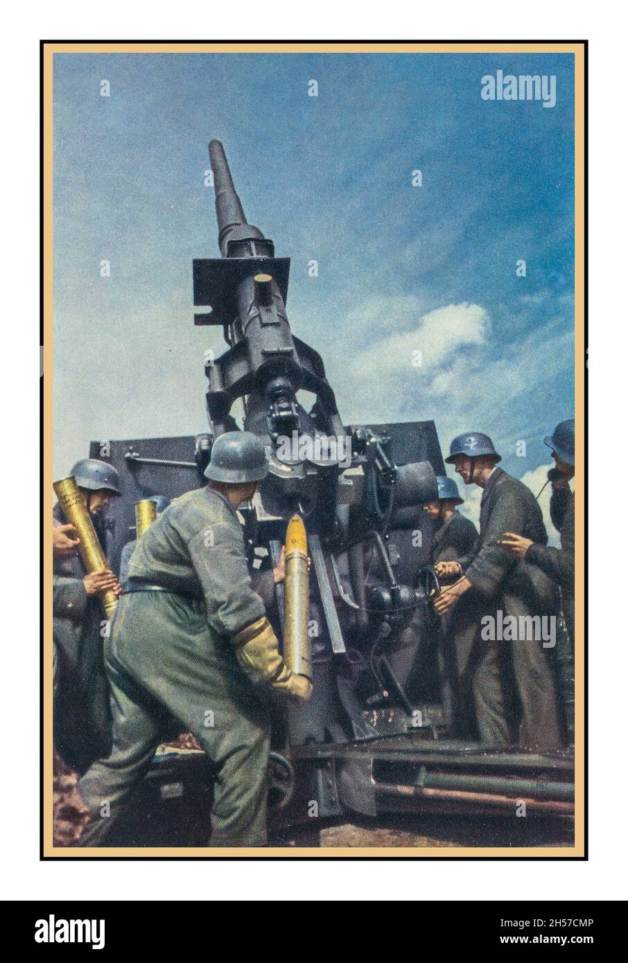 1943 Nazi propaganda colour photo showing a posed heavy anti-aircraft protection battery in operation during World War II Nazi Germany. With German cities being heavily bombed as a retribution for the London Blitz and other non military targets in the UK, Nazi propaganda Miniister Goebbels needed to try and bolster German public confidence with propaganda images of Nazi Germany air defence. Stock Photo