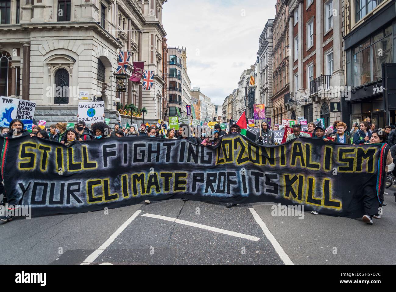 Still fighting colonialism, your climate profits kill banner, Global Day of Action for Climate Justice demonstration, London, UK. 6th November 2021 Stock Photo