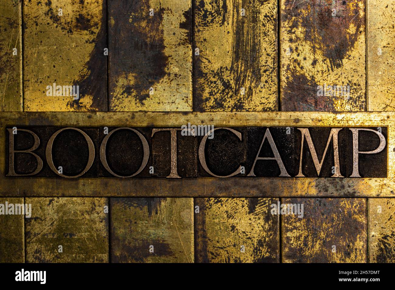 Bootcamp text message on textured grunge copper and vintage gold background Stock Photo