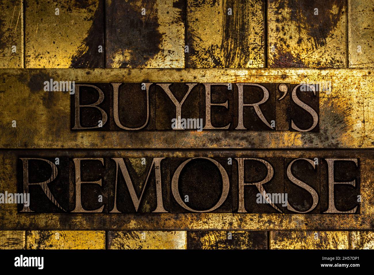Buyer's Remorse text message on textured grunge copper and vintage gold background Stock Photo