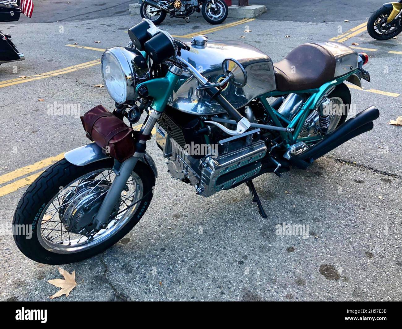 Antique BMW motorcycle, customized in chrome and green. Parked next to other motorcycles. Los Angeles, United States. Stock Photo