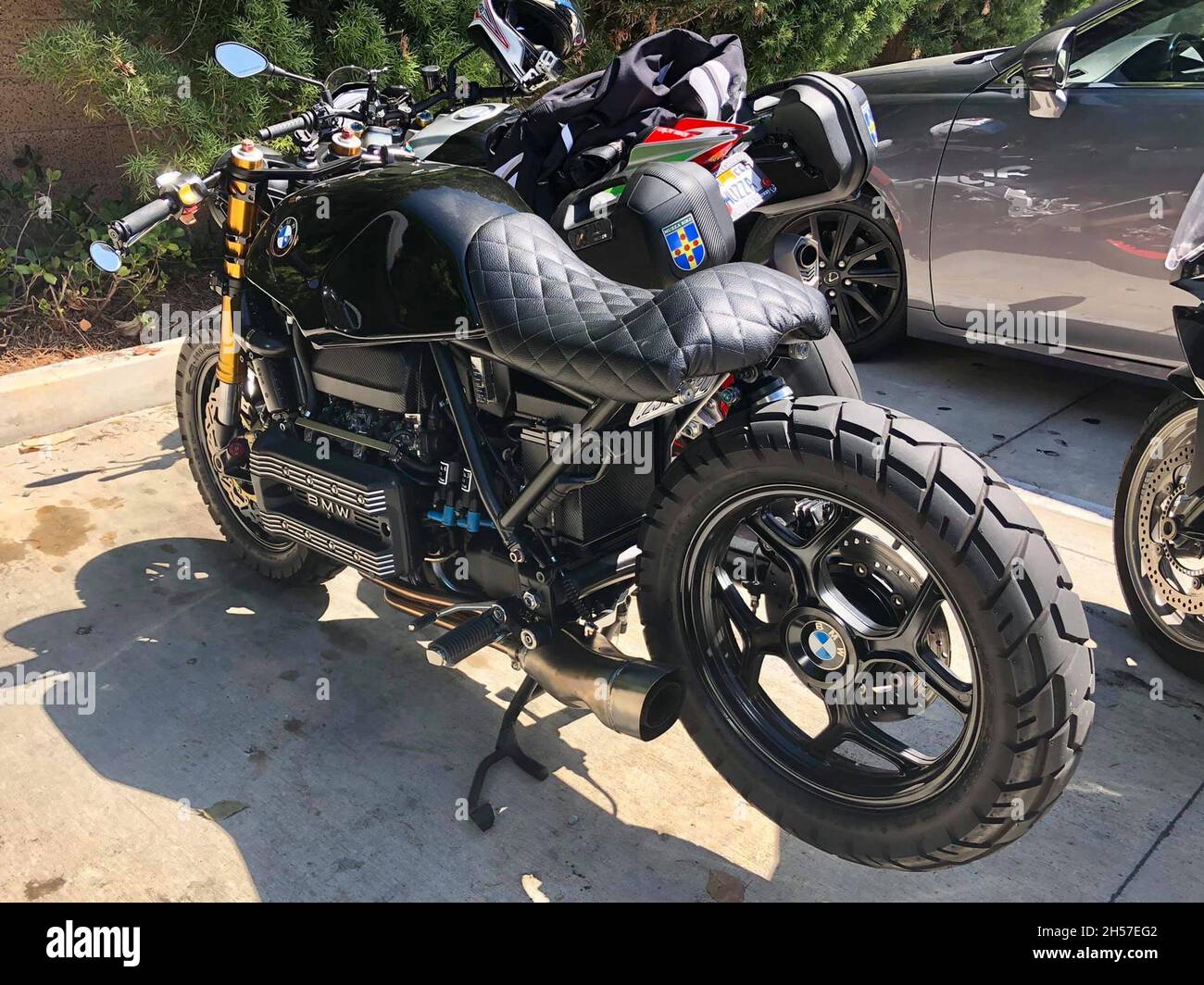 Old, customized BMW motorcycle . Parked next to other motorcycles. Los Angeles, United States. Stock Photo