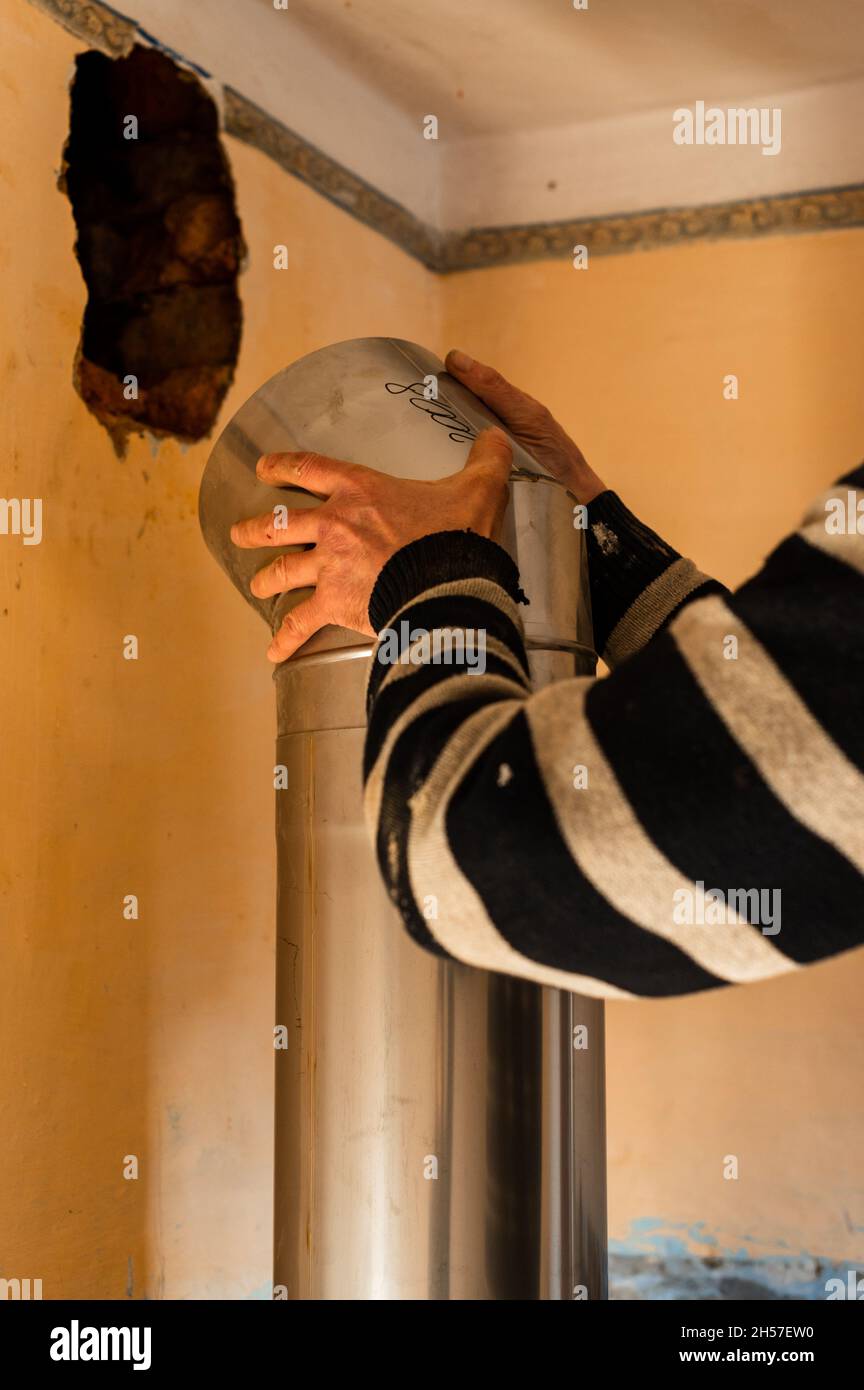 Chimney for the fireplace, installation of a pipe over the fireplace to