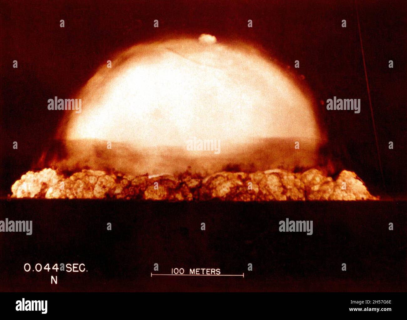 The world's first ever nuclear explosion at the Trinity test site in New Mexico during the Manhattan Project. This image is taken just 44 milliseconds after the detonation. Stock Photo