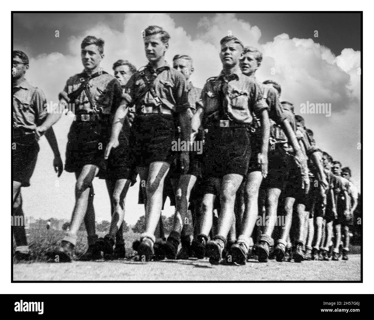 1930s Nazi Propaganda image of marching Hitlerjugend Hitler Youth aged 14-18 years The Hitler Youth was the youth organisation of the Nazi Party in Germany. Its origins date back to 1922 and it received the name Hitler-Jugend, Bund deutscher Arbeiterjugend Stock Photo