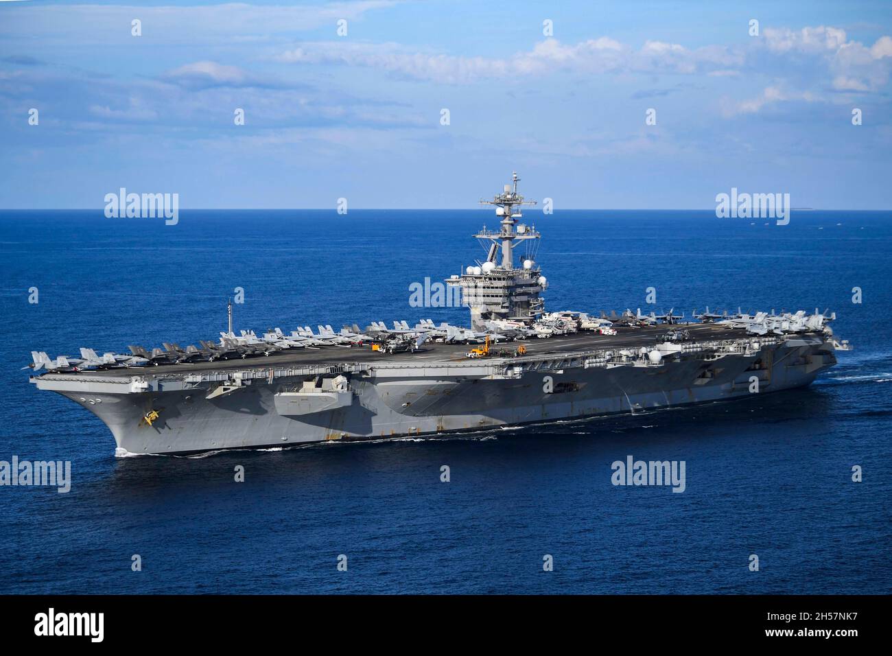 South China Sea, United States. 04 November, 2021. The U.S. Navy Nimitz-class aircraft carrier USS Carl Vinson sails in formation during a routine patrol, November 4, 2021 in the South China Sea.  Credit: MC1 Tyler Fraser/U.S. Navy/Alamy Live News Stock Photo