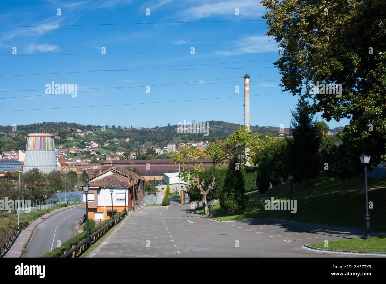 Road to La Felguera, an industrial city in Langreo. On the left side, an old industrial colorful tower that is nowadays MUSI, a Museum. Langreo, Astur Stock Photo