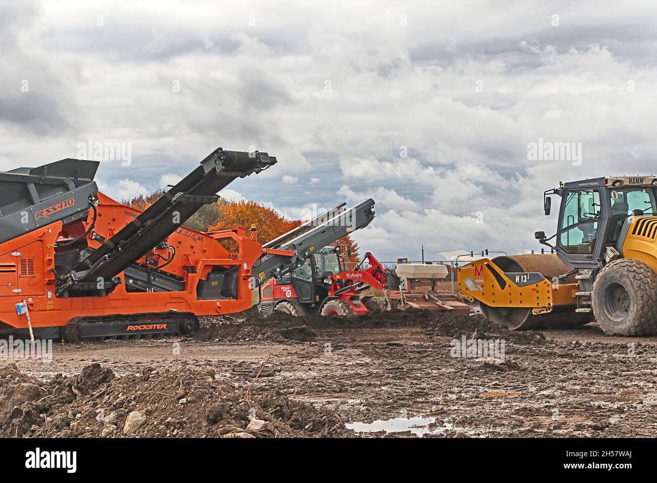 Construction site in development with bulldozers and compactors working