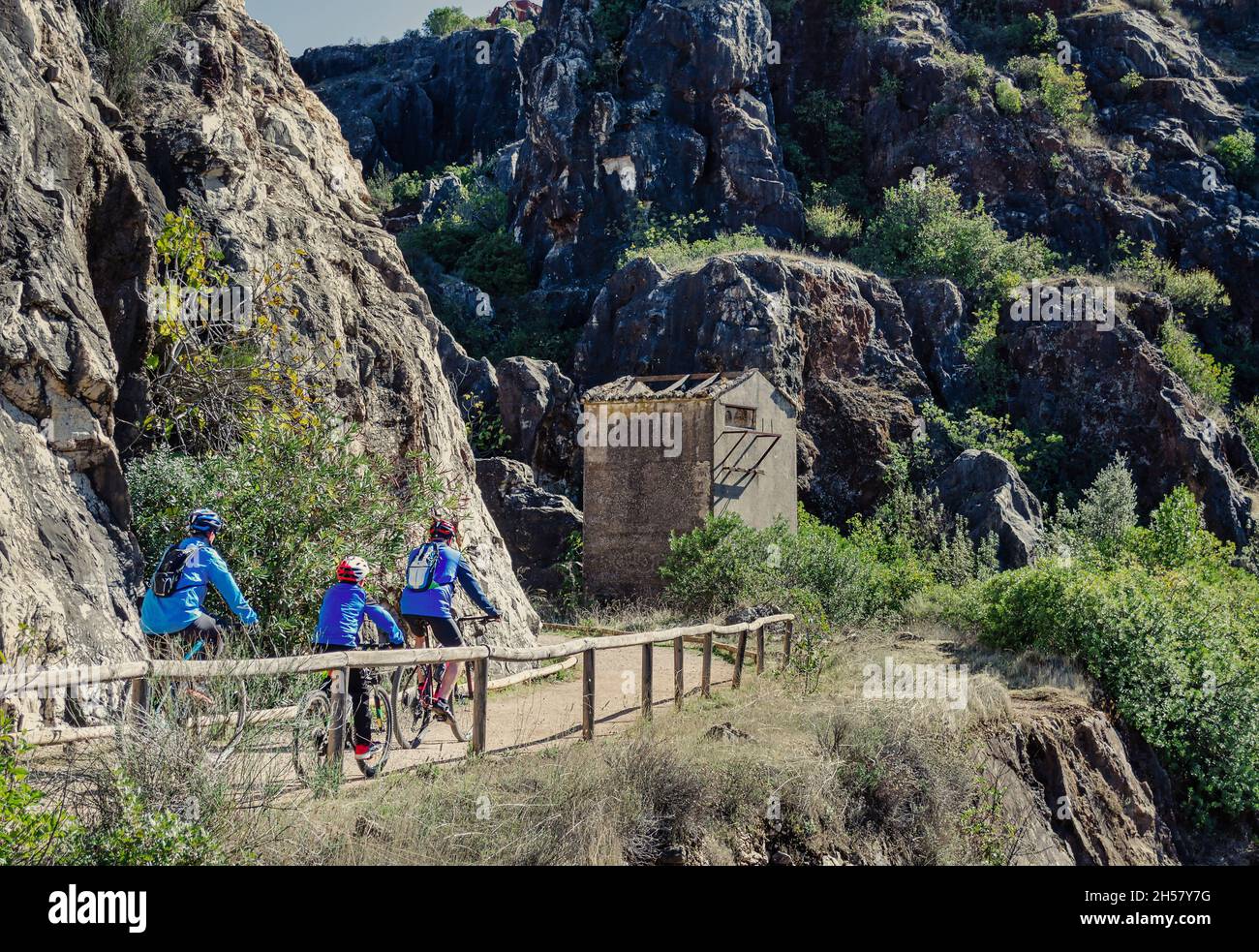 Family riding bikes at the Cerro del Hierro, Seville, Spain Stock Photo