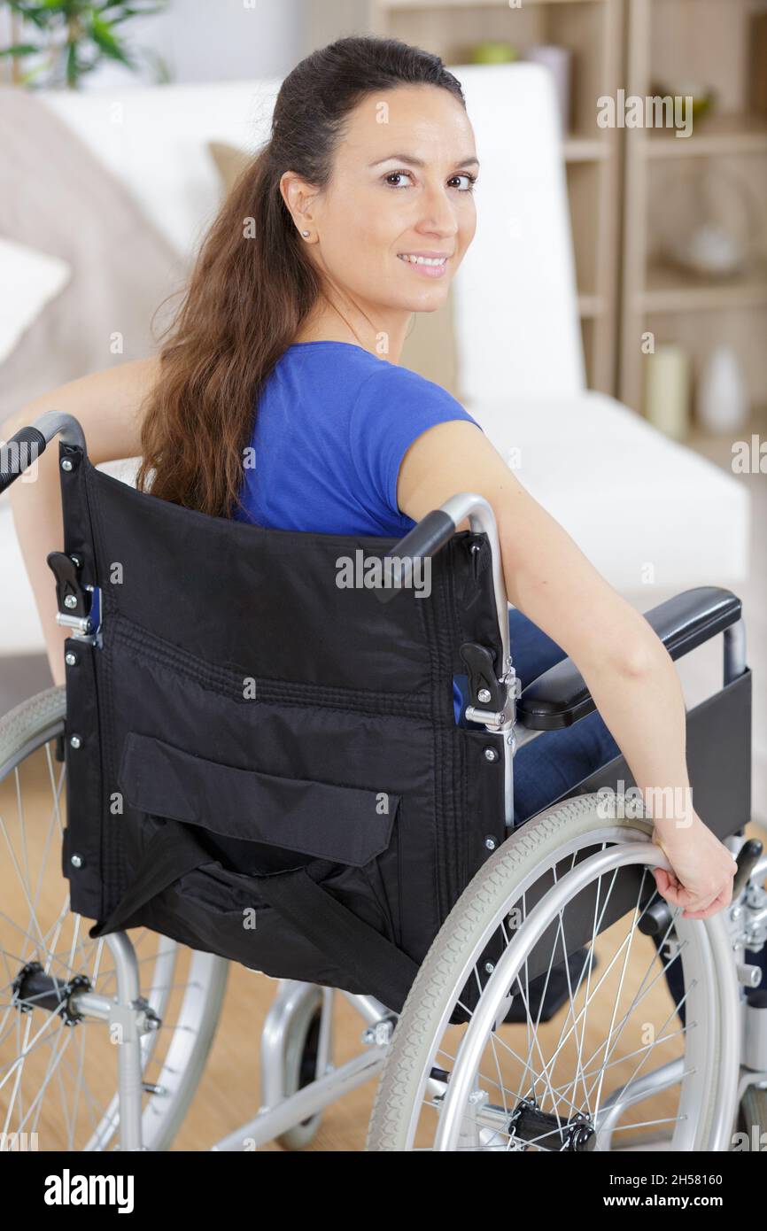 a happy woman in a wheelchair Stock Photo - Alamy