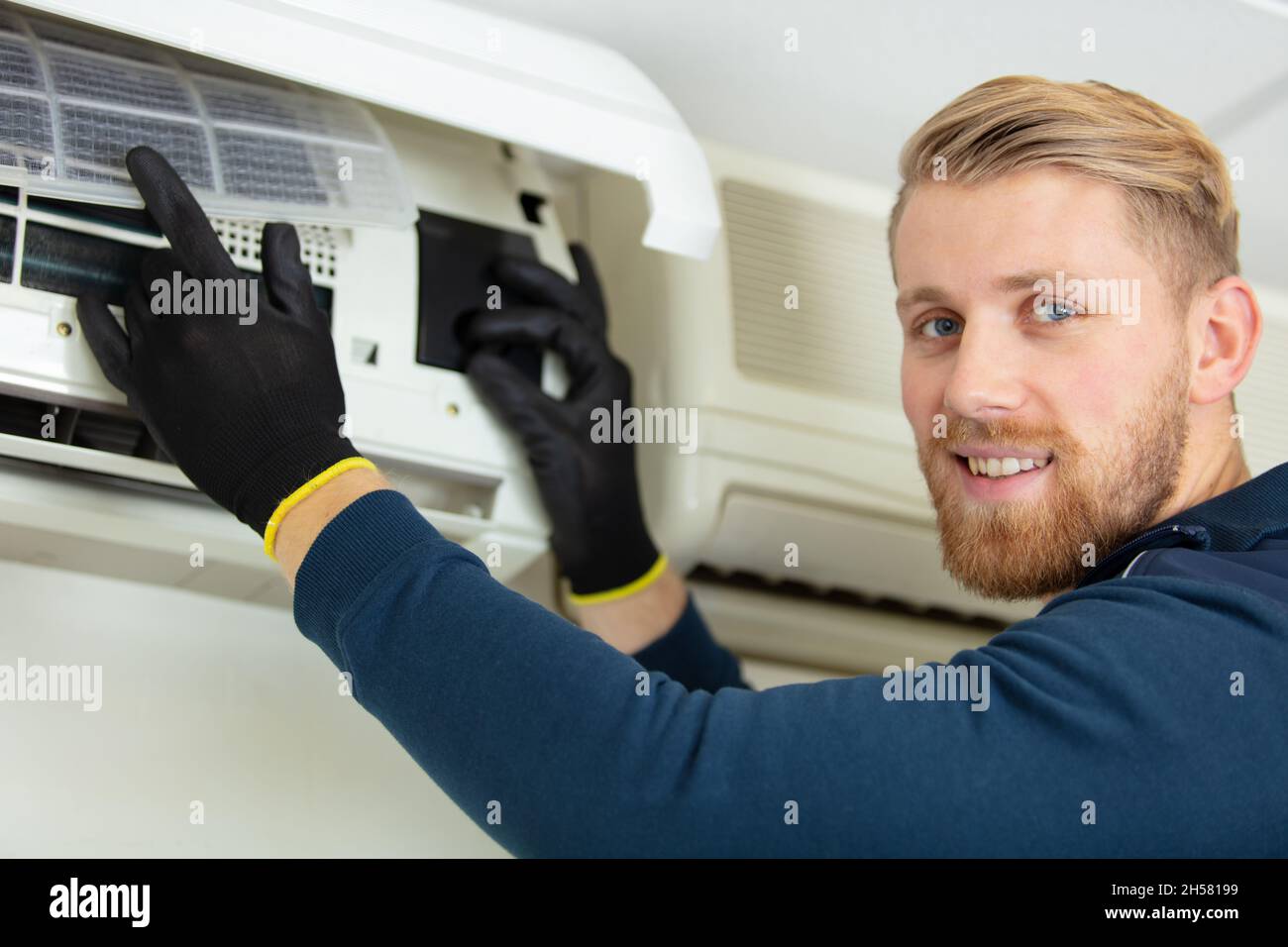 Technician repairing air conditioner hi-res stock photography and ...
