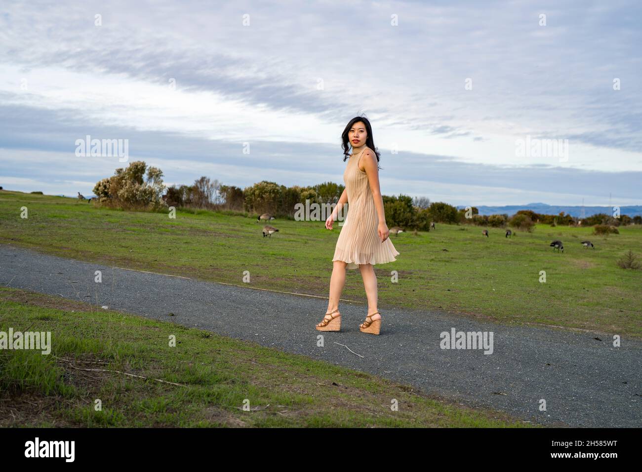 Asian female walking hi-res stock photography and images - Alamy
