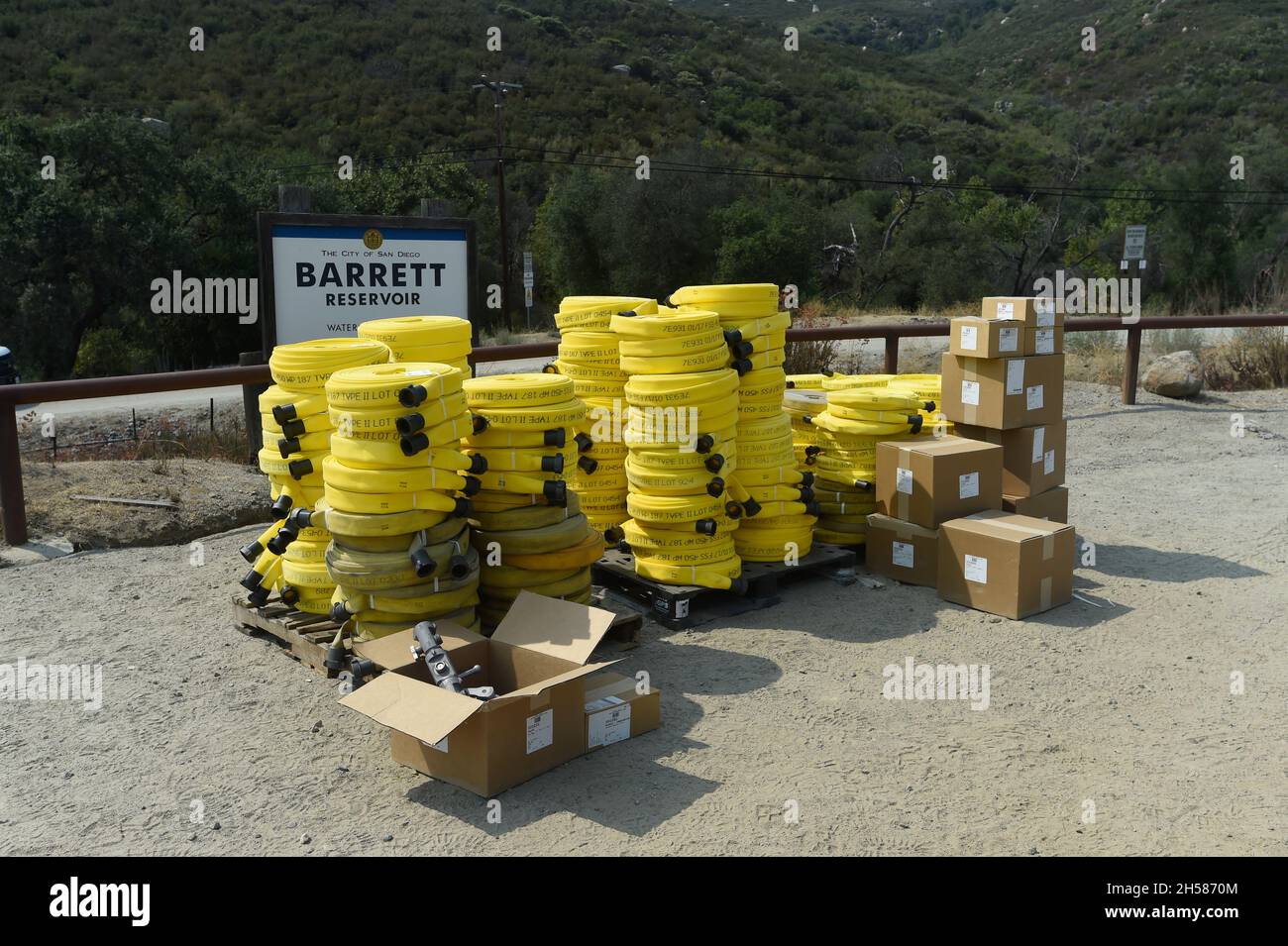 Cal Fire hose packs and associated valves await use at wildland fire east of San Diego, California. Stock Photo