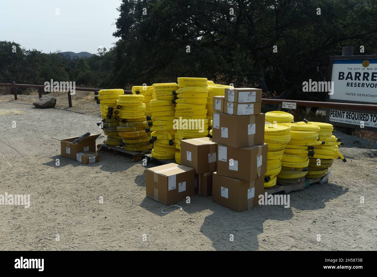 Cal Fire hose packs and associated valves await use at wildland fire east of San Diego, California. Stock Photo