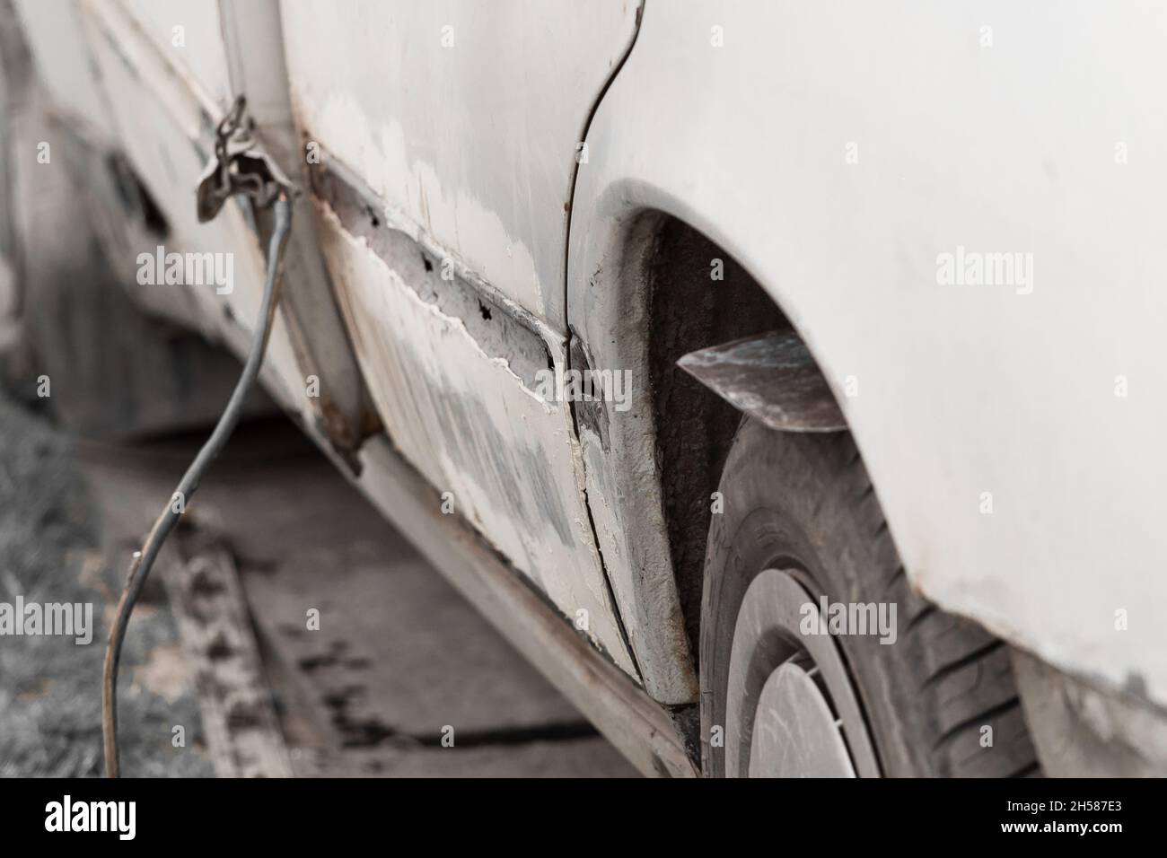 Repair of the rear door of the car. Elimination of the broken body of transport. Stock Photo