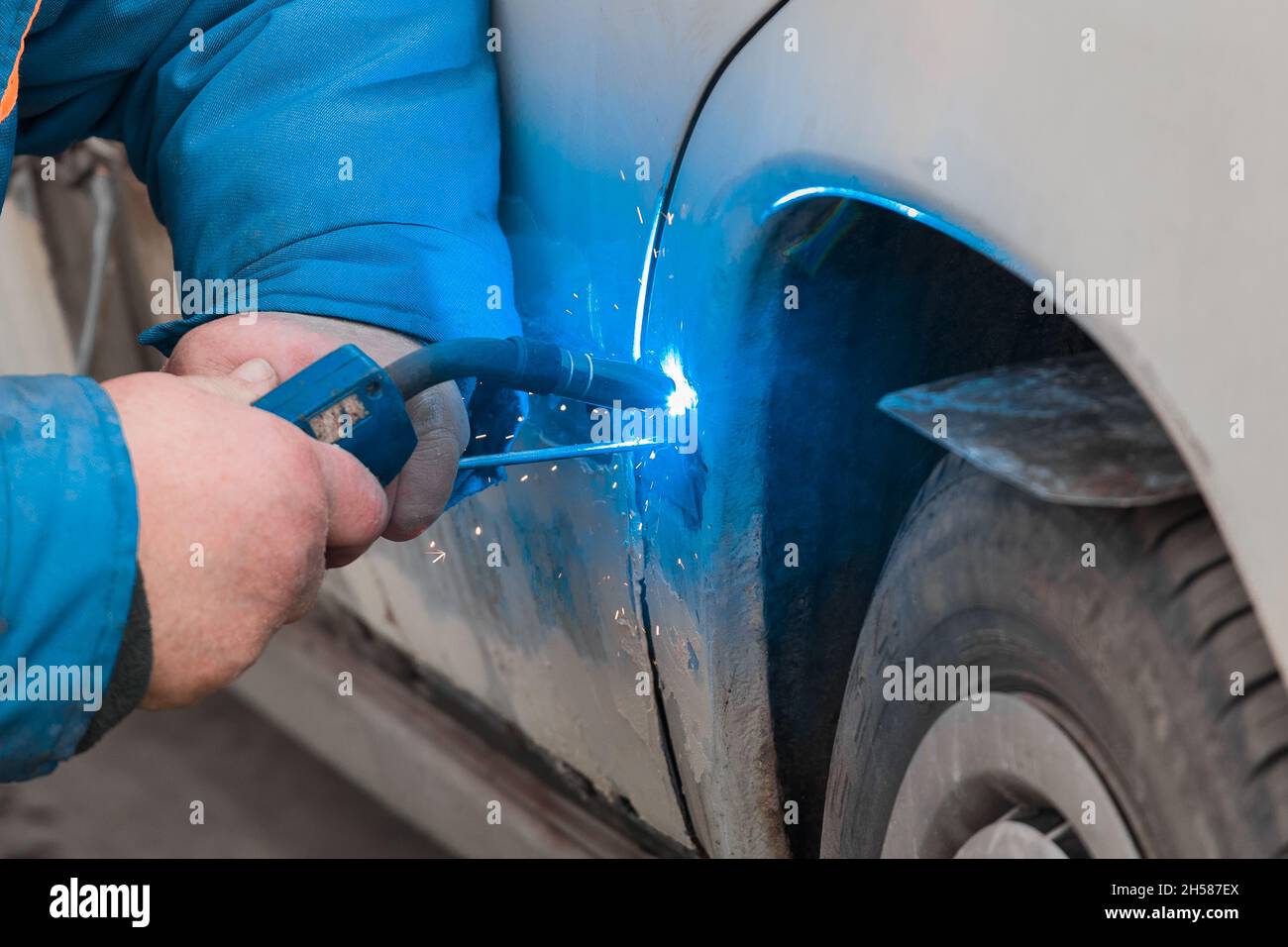 Welding and metal works repair of the car body Stock Photo Alamy