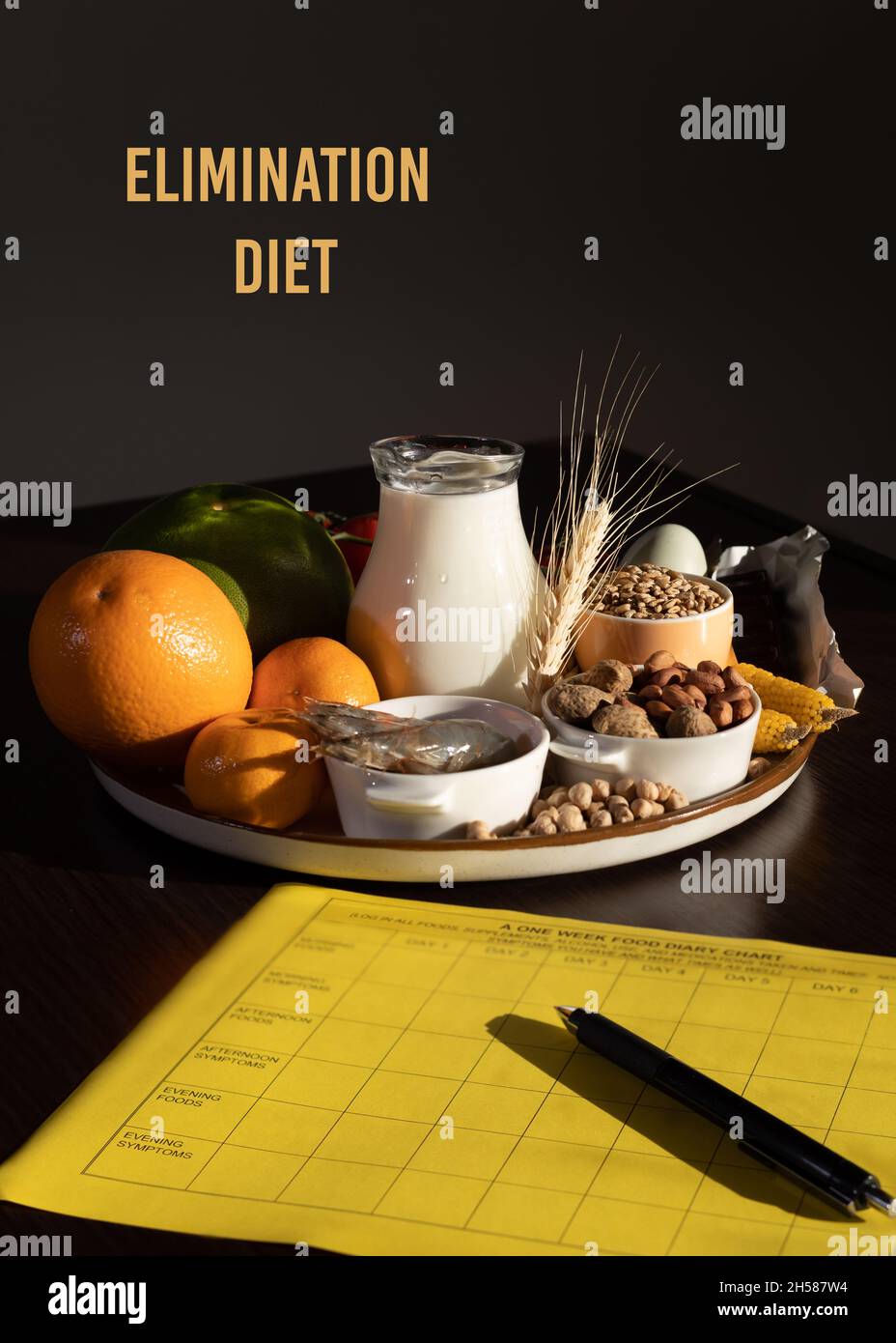 Elimination diet concept. Food allergens on plate - fish, seafood, dairy, peanuts, tree nuts, eggs, chocolate, wheat, soy, citrus fruits. Stock Photo
