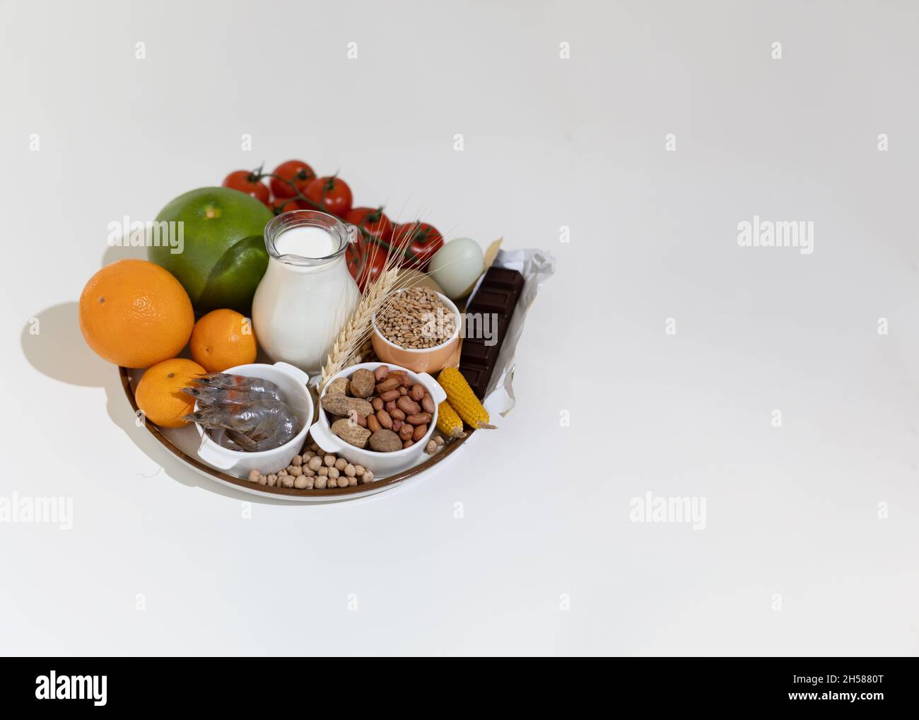 Elimination diet concept. Food allergens on plate fish, seafood