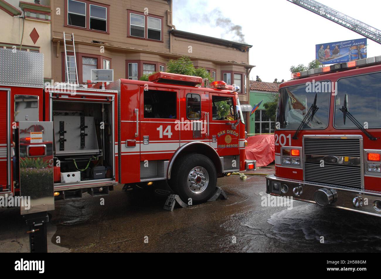 San Diego Fire-Rescue Truck 14 and Engine 201 on scene at a structure fire on University Avenue in San Diego, California Stock Photo