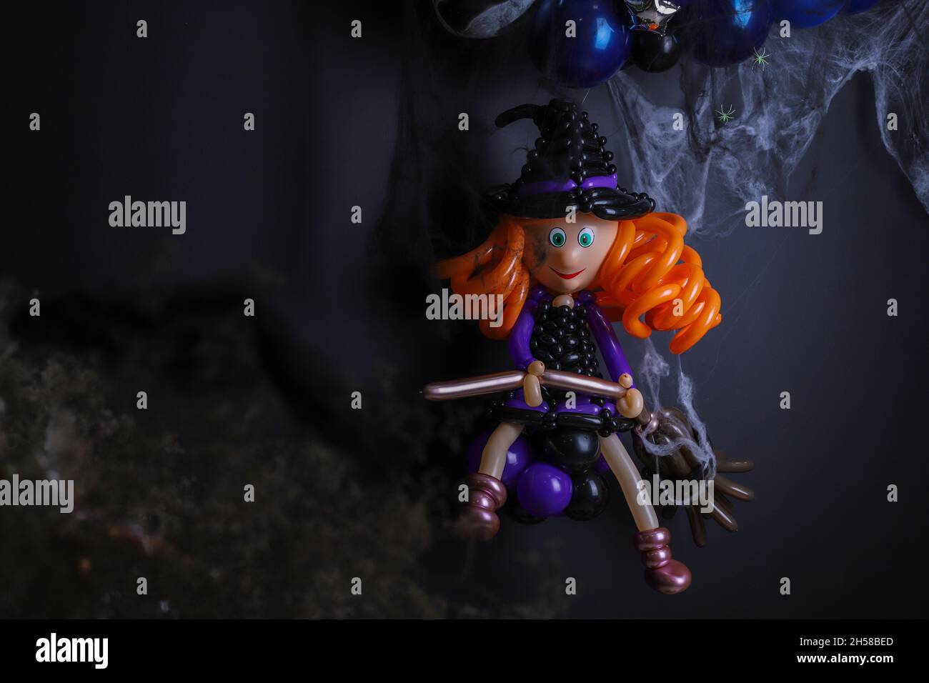 The figure of a witch from balloons. Decoration on Halloween from balloons. Stock Photo
