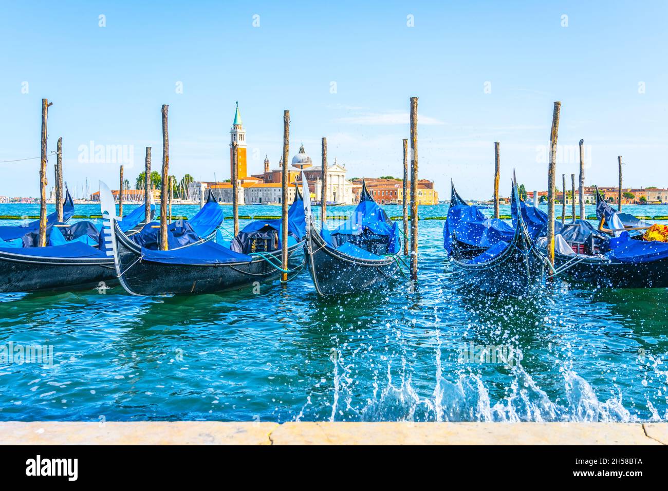 Romantic gondolas moored in Venice Stock Photo - Alamy